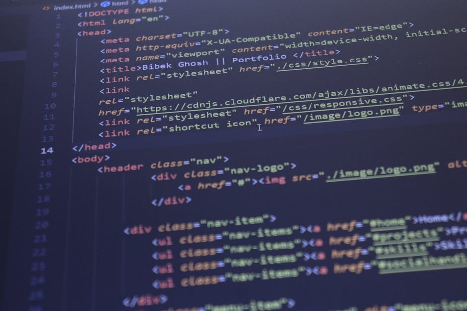 A close-up photograph of a computer screen displaying lines of multicolored code in various programming languages. The screen features a dark background with syntax-highlighted text in colors such as 